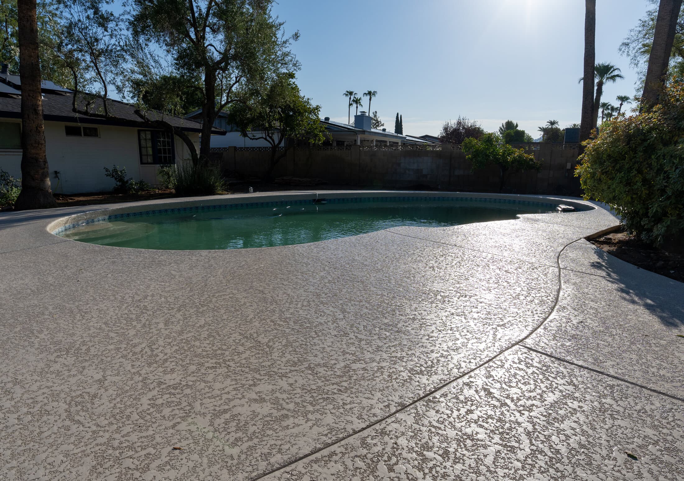 Cool deck resurfaced pool patio in Greater Phoenix backyard