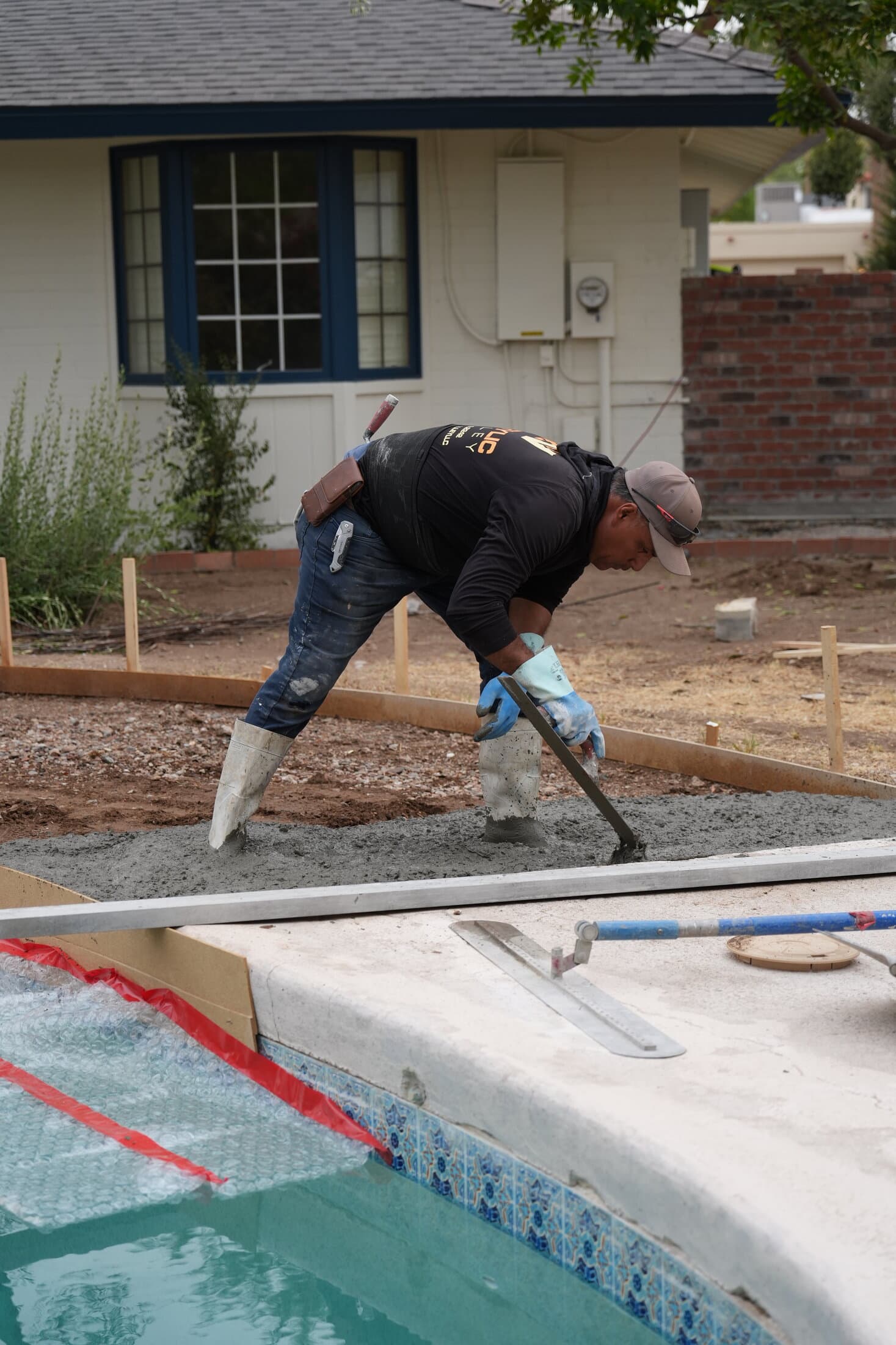 Acrylic Valley crew member finishing pool coping
