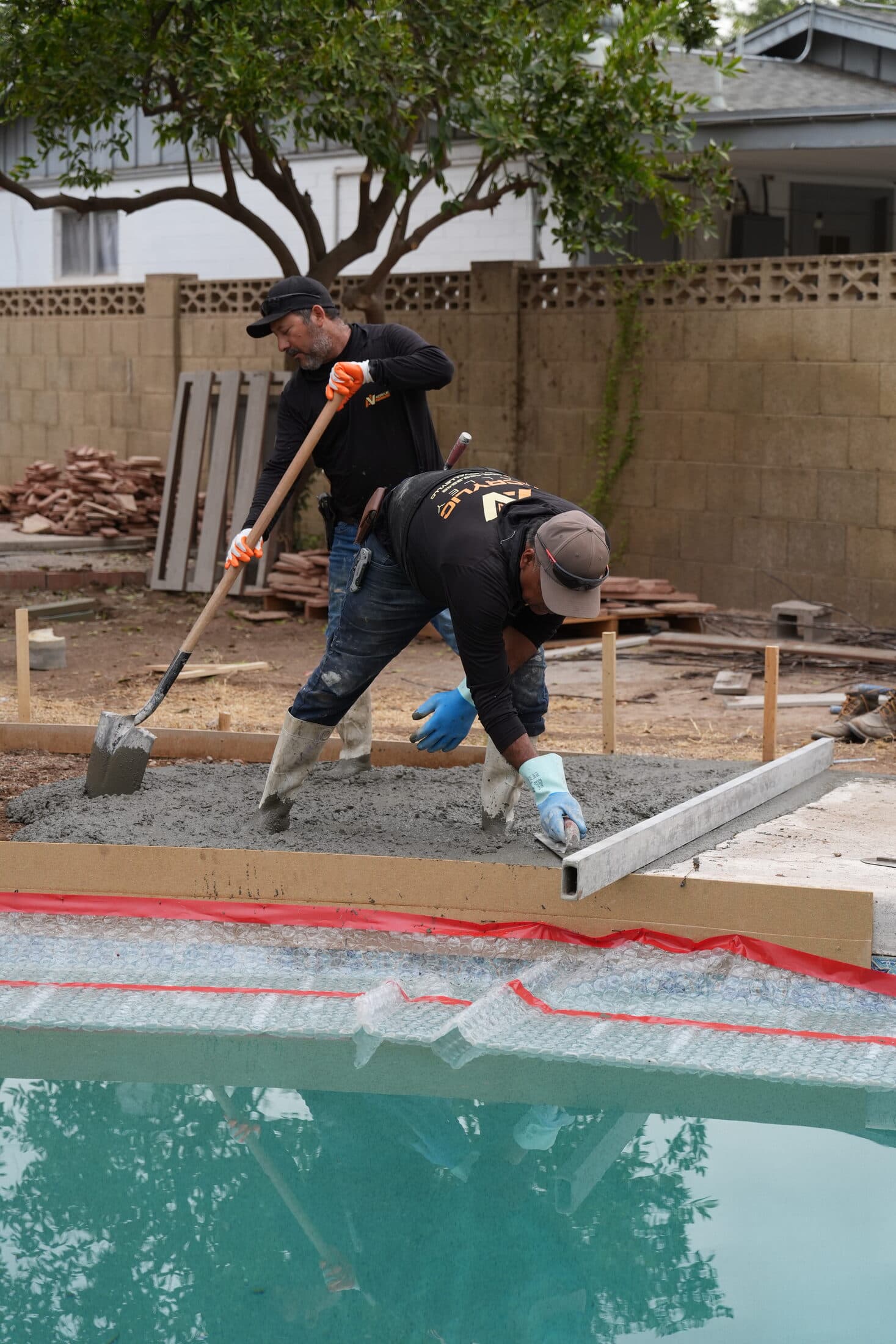 Acrylic Valley crew pouring concrete on a Phoenix pool deck project
