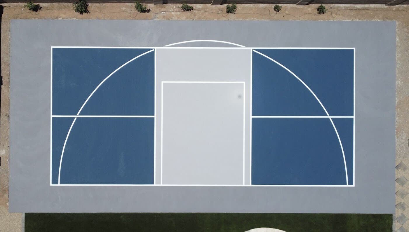 Aerial view of a custom backyard basketball court installation